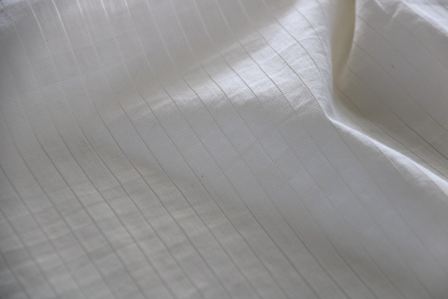 Lightweight woven-like warp knitted fabric produced on KARL MAYER’s TM WEFT. The new collection features flowing drape, crêpe-like textures and subtle transparency, with the lightest fabric weighing just 63 g/m².