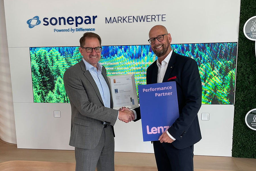 (c) 2025 Lenze SE - Dr Marc Wucherer, CEO of Lenze, presents Ulf Böing, Director of Industrial Sales at Sonepar Germany, with the partner certificate.